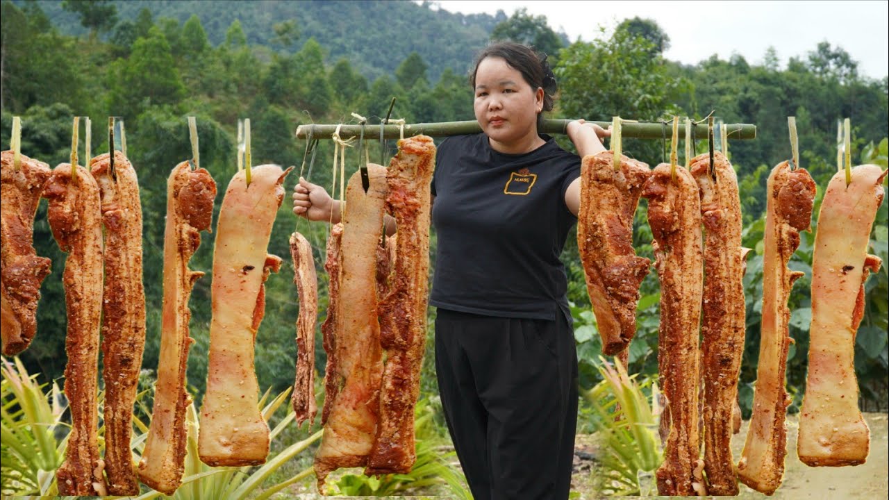 The process of making pork hung over a fire - a traditional Vietnamese dish.