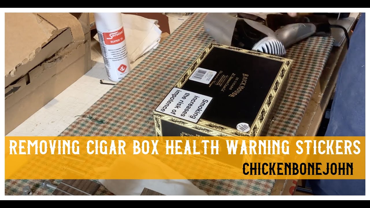 Removing health warning stickers from cigar boxes