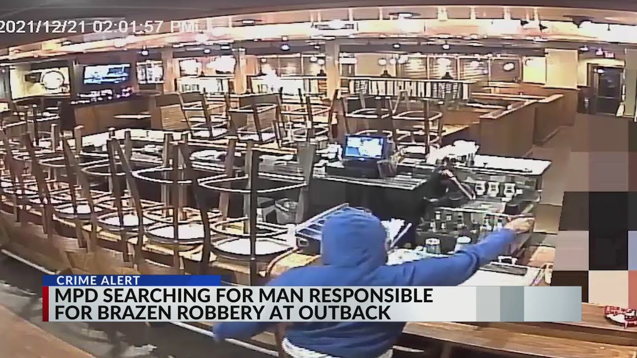 Armed suspect robs Outback Steakhouse on video