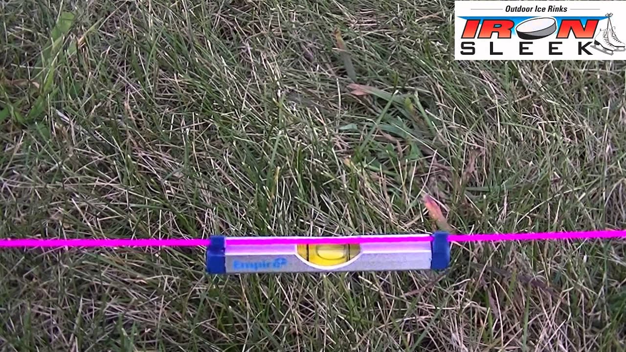 Measuring Grade for a Backyard Rink with a line level.