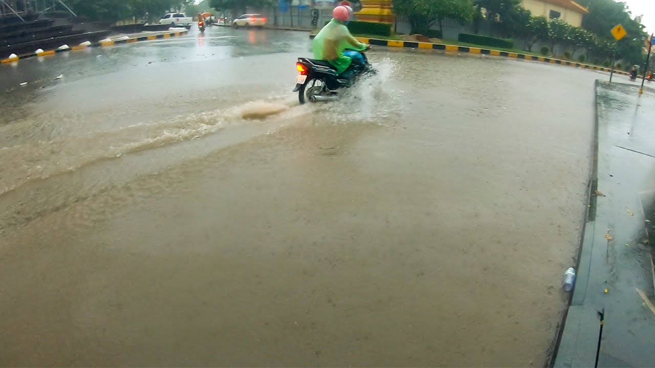 Unclogging Culvert Drain Flood Rain On Street Road While Raining