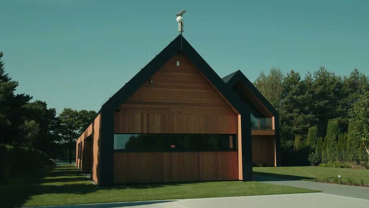 Dom na Kujawach. Nowoczesne stodoły nad malowniczym jeziorem spod kreski Exterio architektura