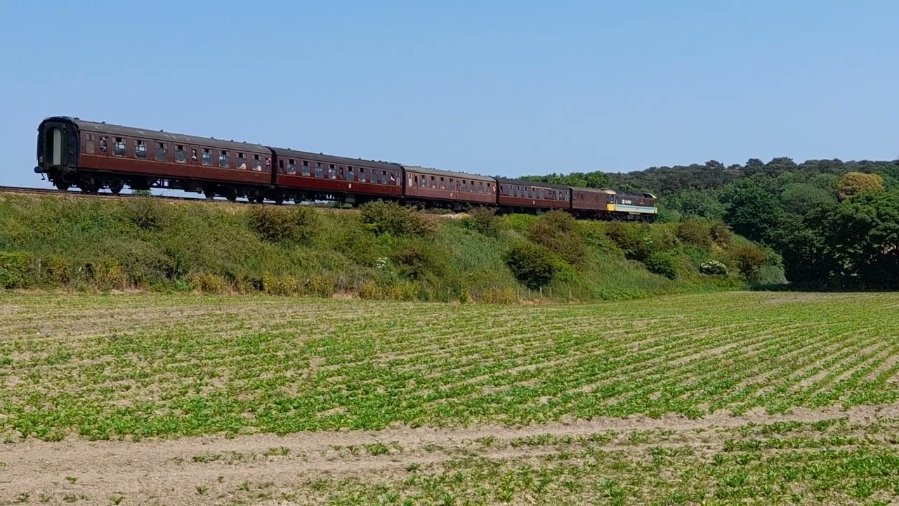 47712 from the north norfolk railway seen passing through the sunny norfolk countryside on 10/6/23