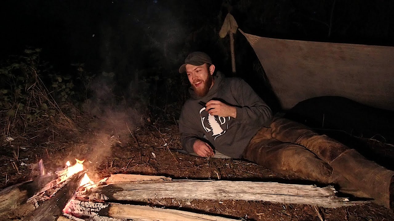 Backcountry Bedroll Camp Next To Forest Creek