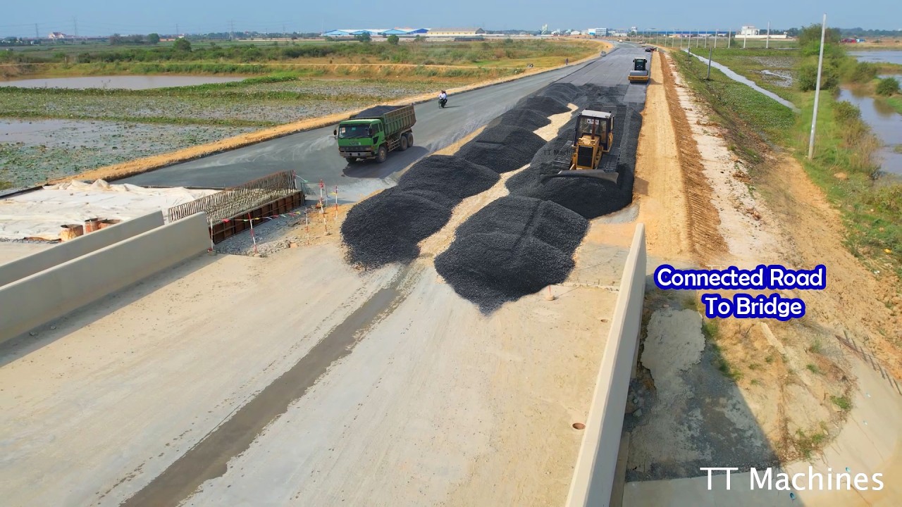 Skillful Operators Building High Way Road Connected To Bridge By Dozer D41P Spreading Gravel