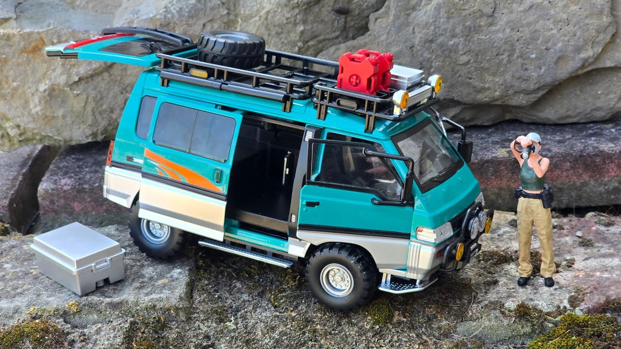 This is too cool. Mitsubishi Delica 1/24 scale with Opening parts, light and sound, accessories.