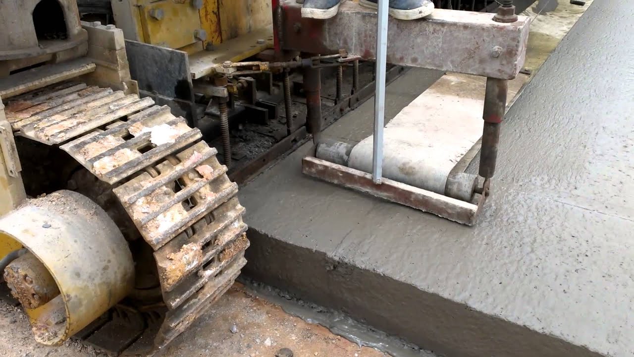 THI CÔNG MẶT ĐƯỜNG BÊ TÔNG XI MĂNG VÁN KHUÔN TRƯỢT