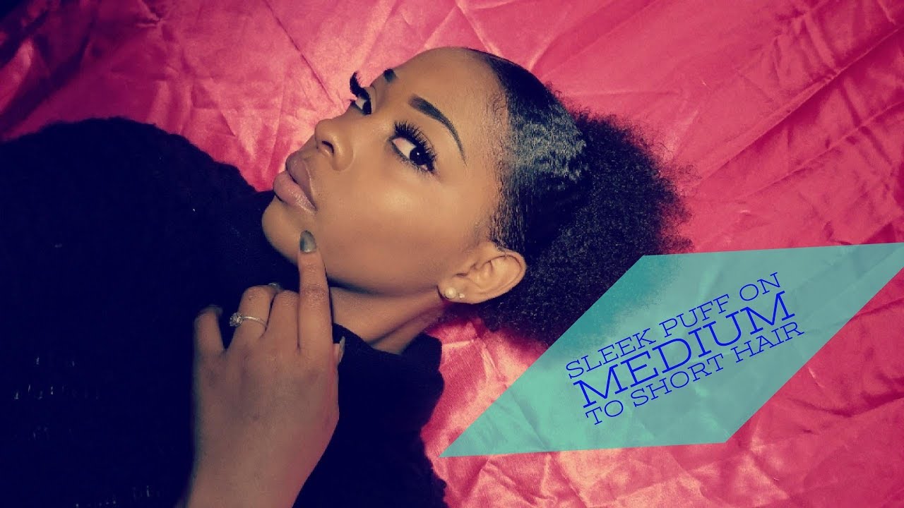 Sleek low puff on short to medium natural hair