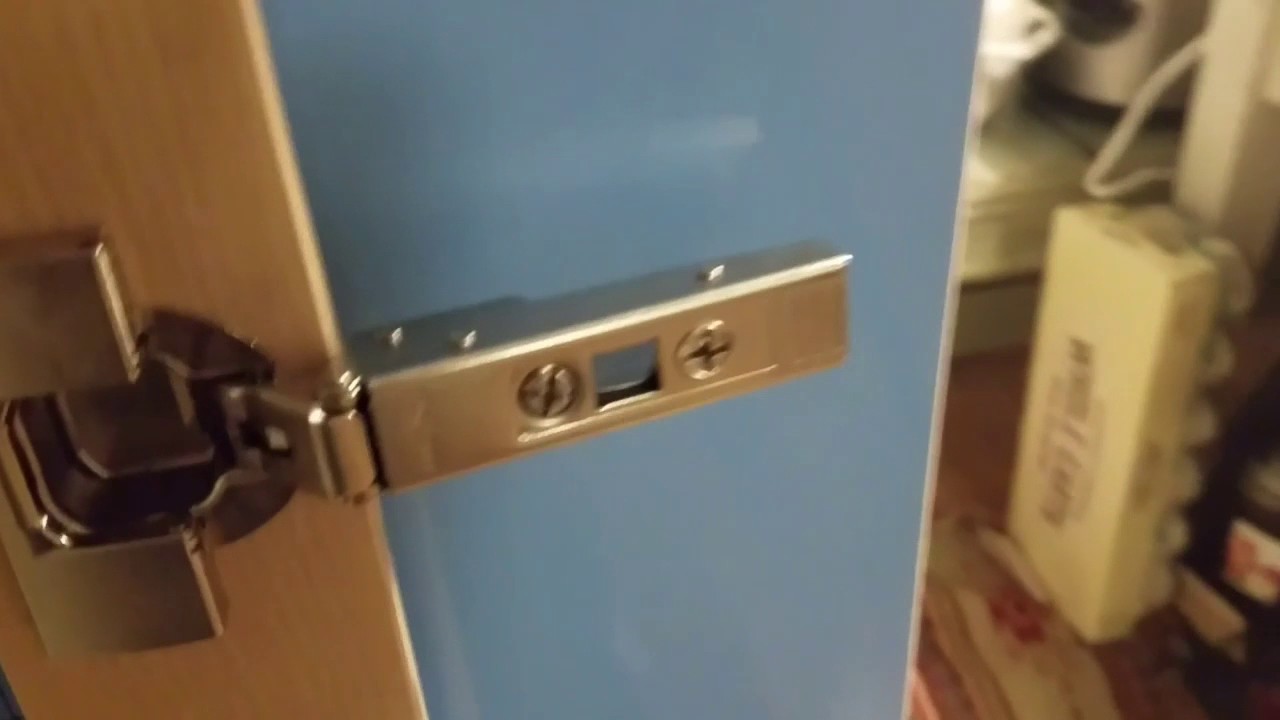 Installing Ikea Utrusta hinges on Sektion cabinet.