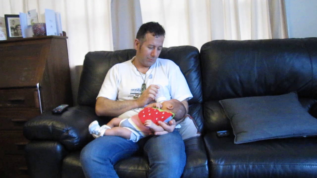 Daddy feeding Luana
