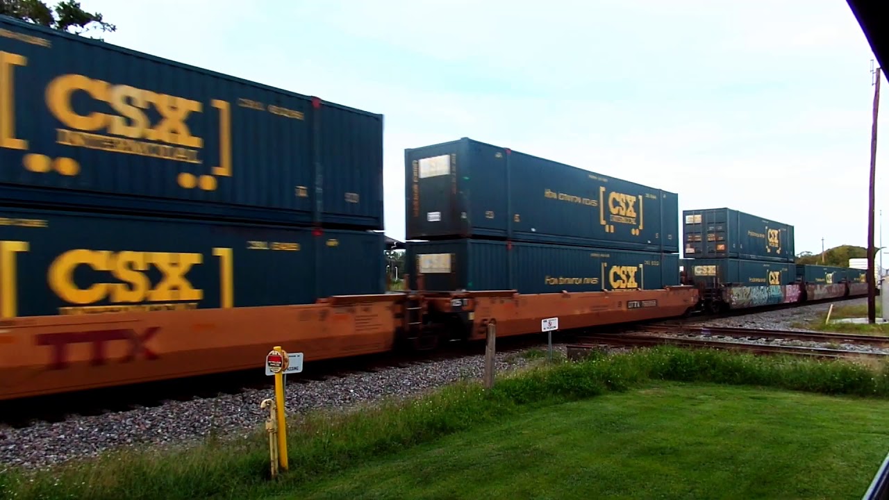 CSX Freight Train Follows Amtrak Passenger Train