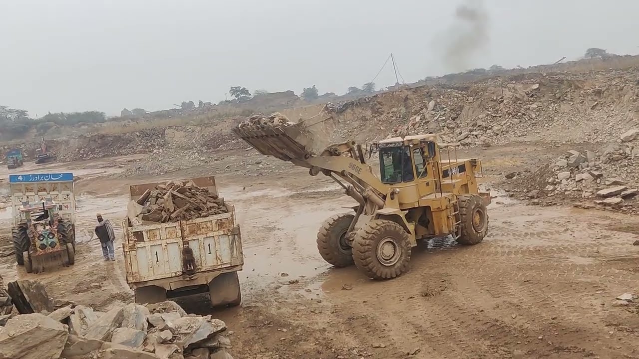 Trolley loading Stone with Caterpillar Loadar in mountain: #mountainview 