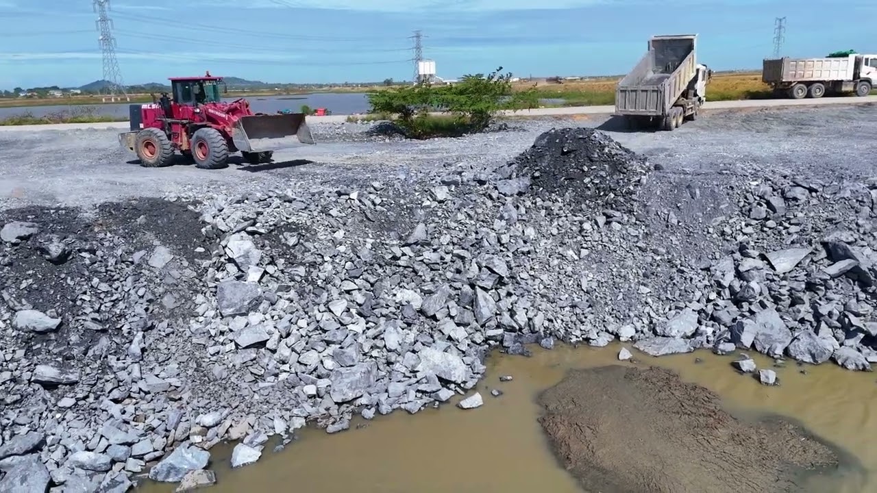 Part02,Activitiy Development,Beginning a new road project with a skilled dozer pushing a dump truck