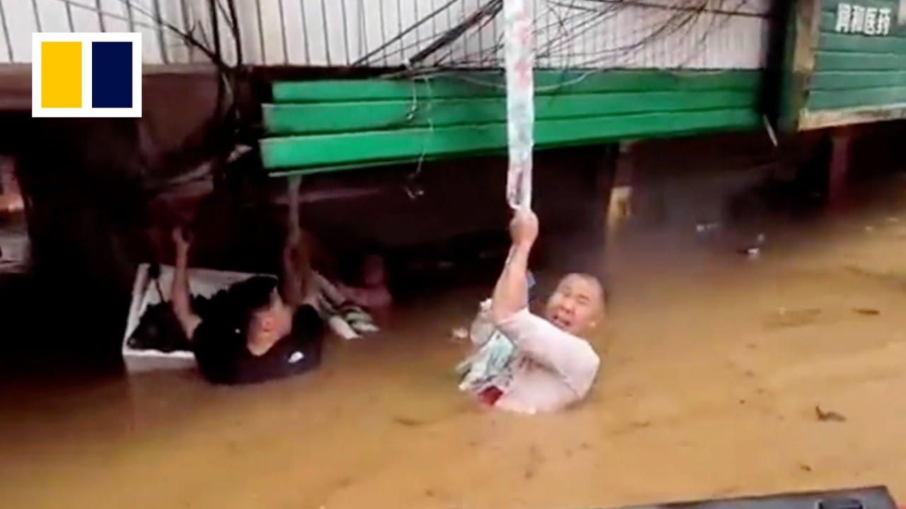 &lsquo;Save her first&rsquo;: Chinese man keeps pregnant wife above water for 3 hours in floods