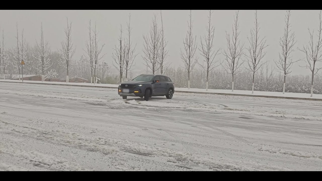 Drifting Mazda CX-50 Hybrid in snow