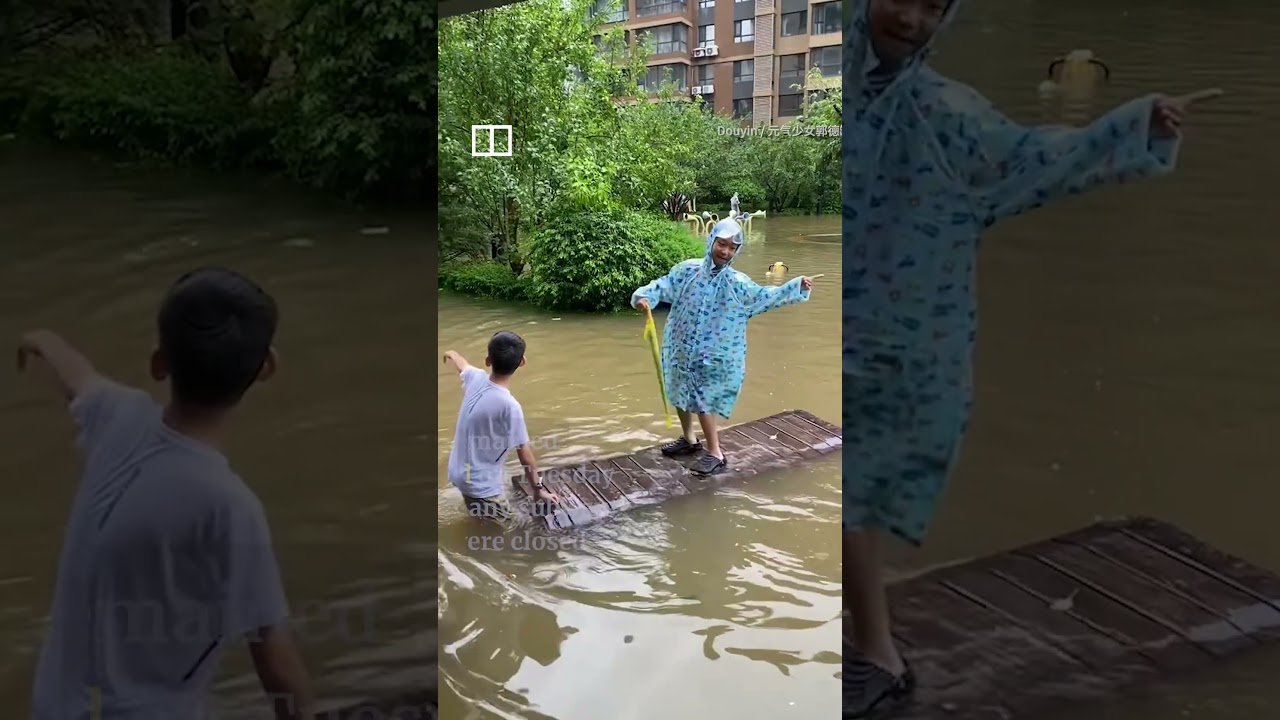 Residents ride floodwaters in northern China