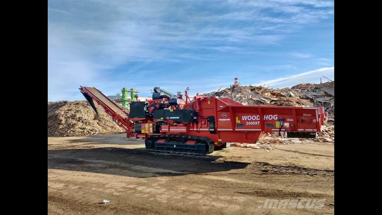 Grinding logs with chipping mill in 3400 Morbark Wood Hog