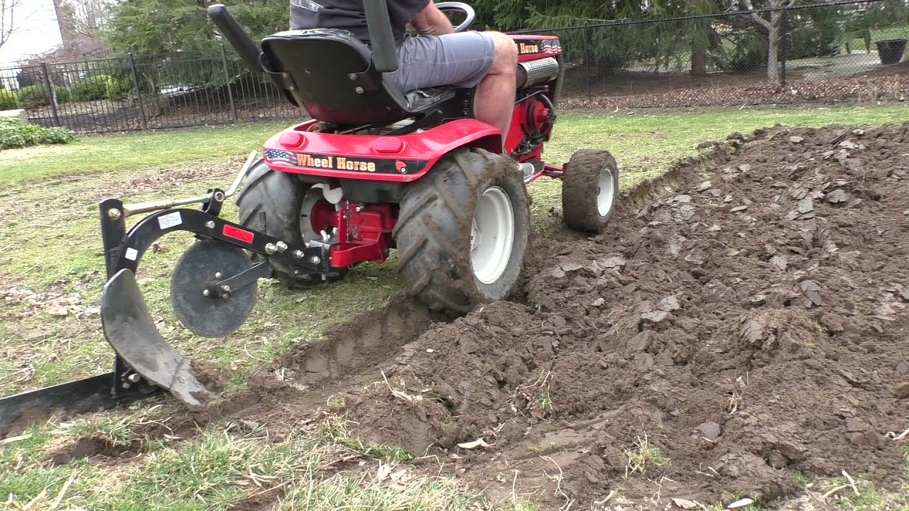 Plowing the garden with the Wheel Horse