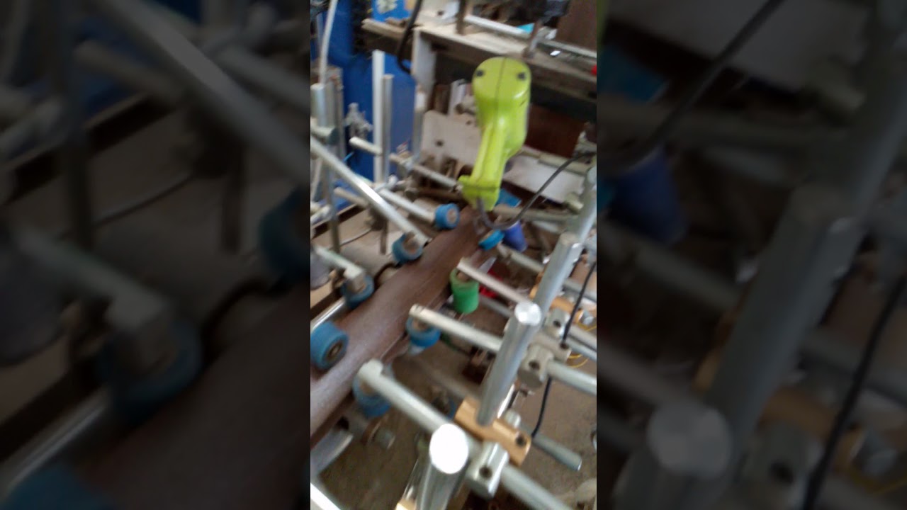 تلبيس مقطع برواز WPVC ( كومبوزيت ) على آلة تلبيس PVC
