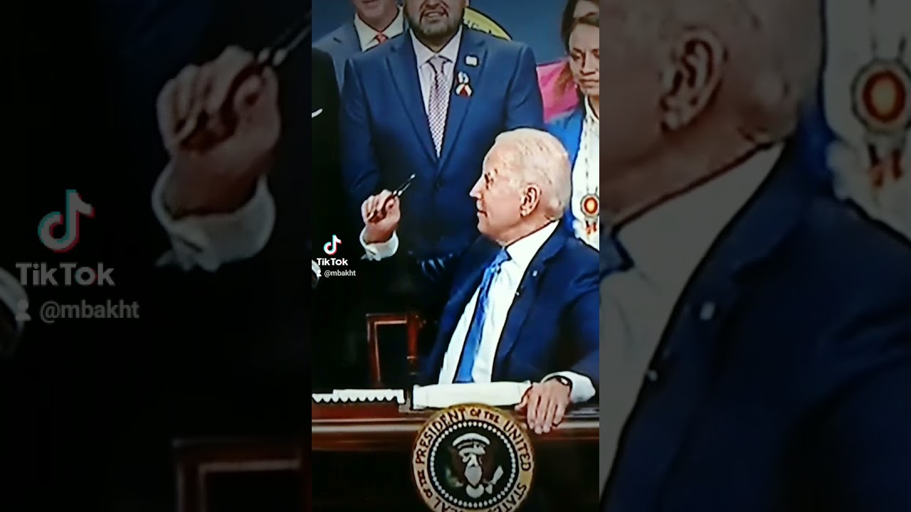 President Joe Biden Signed documents in Oval office.