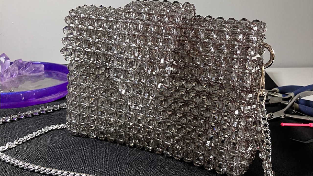 Acrylic beads clutch bag with an extra feature