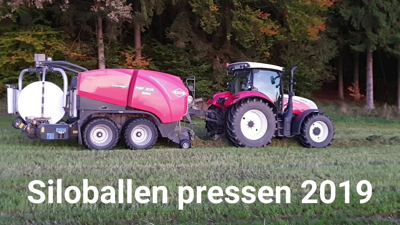 Siloballen pressen mit Steyr 6125 Profi + Kuhn Intelliwrap
