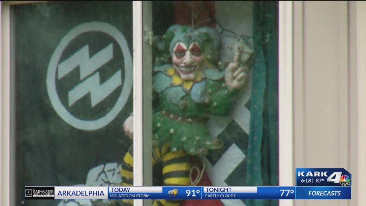Benton neighbors concerned after man displays Nazi flags in front window