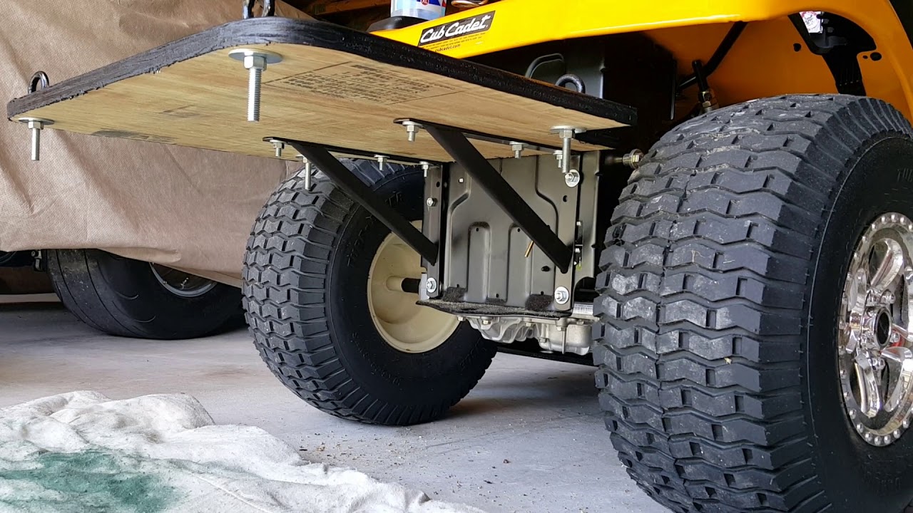 Broadcast and spot sprayer lawn mower mount.