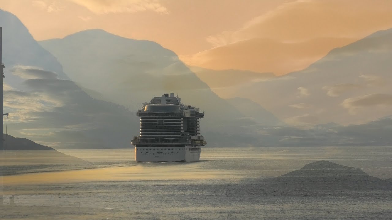 Iona Sailing into Olden following behind AIDAnova Cruise Ship along the Norwegian Fjords.