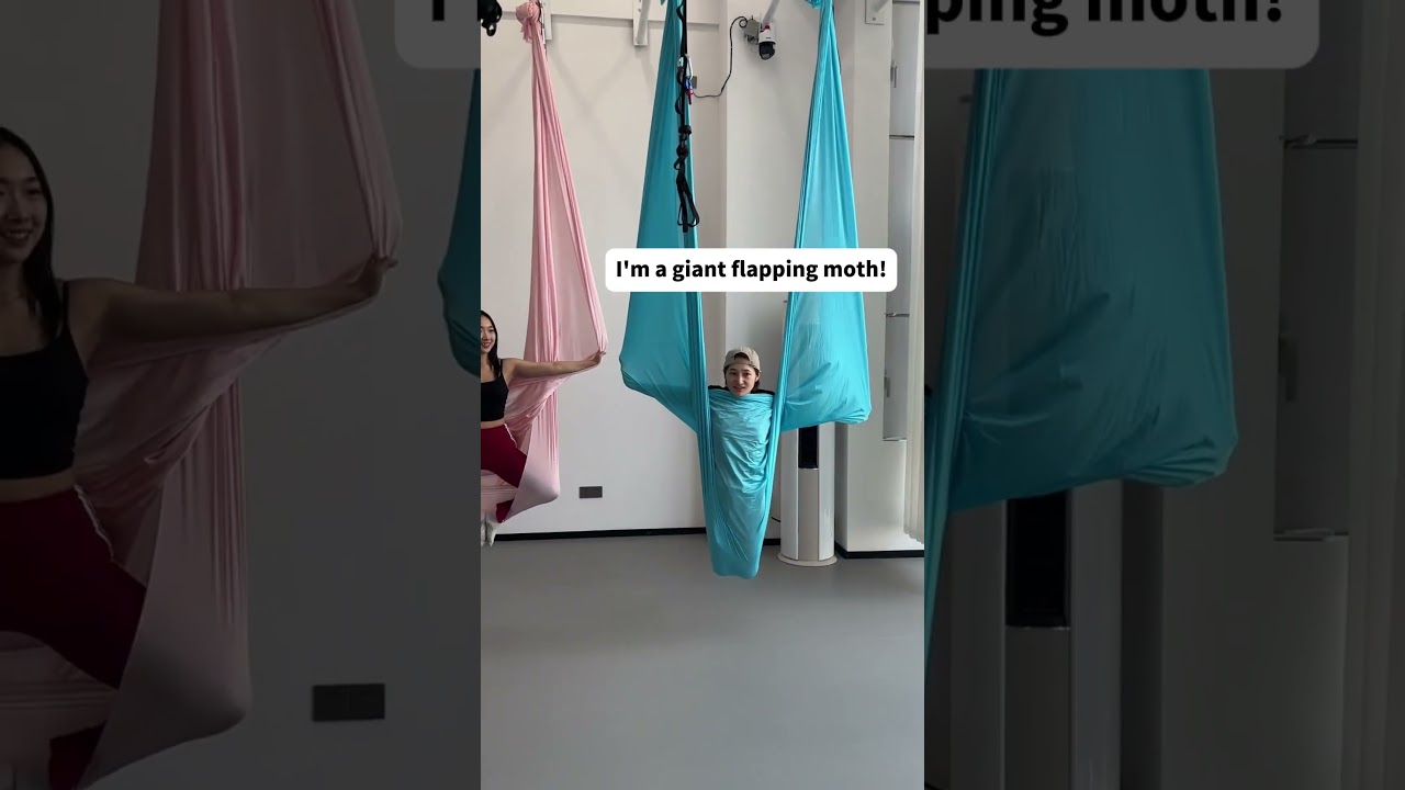 She Tried Learning the Basics of Aerial Yoga.