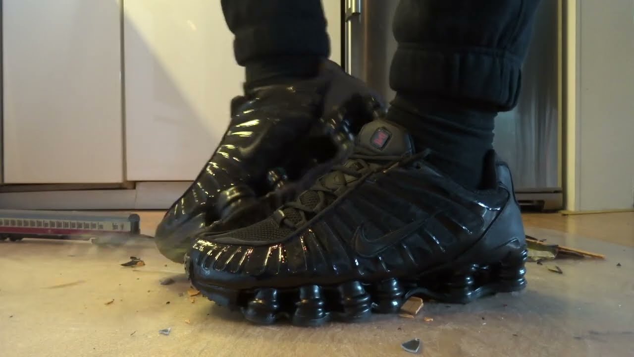 Brand new Nike Shox TL stomp, trample and destroy some vintage model train wagons