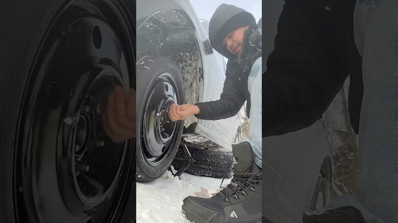 changing a tire during blizzard condition
