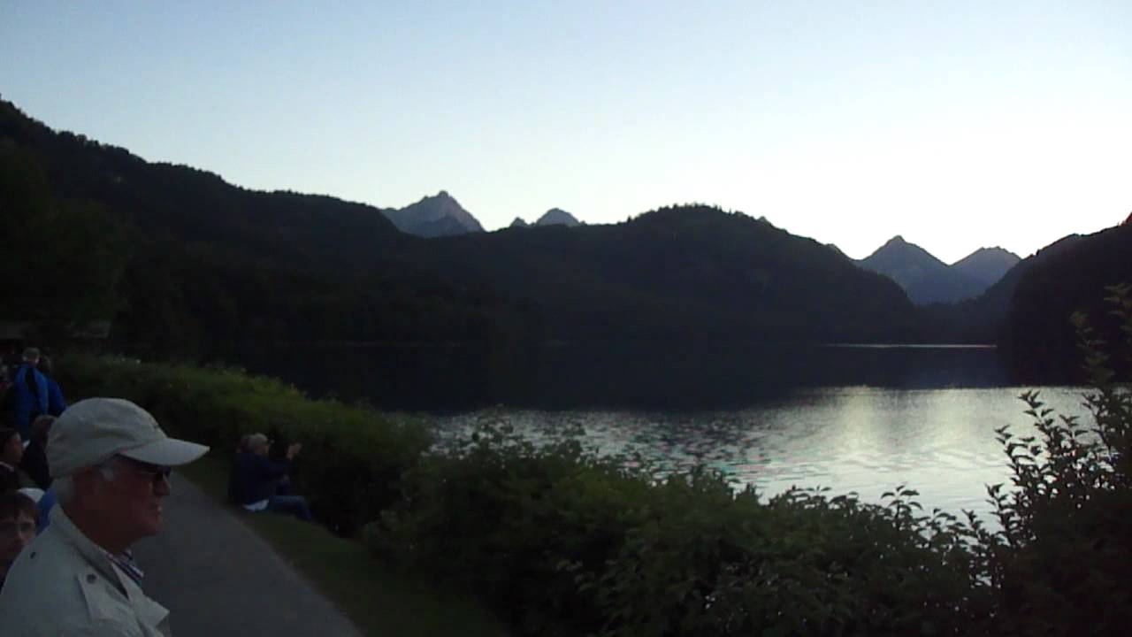 Alphorn music echoing at Alpsee Lake in Hohenschwangau Bavaria