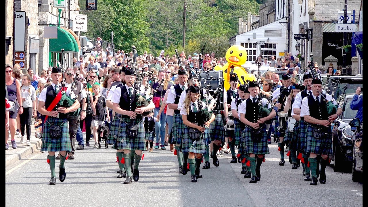 2018 Ballater Duck Festival with Ballater Pipe Band parading the winning duck in Deeside, Scotland