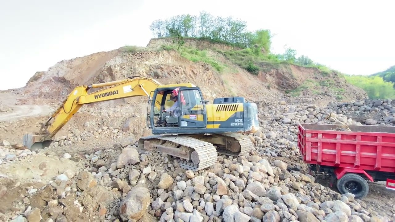 Powerful Hyundai Excavator Loads Dump Truck with Ease