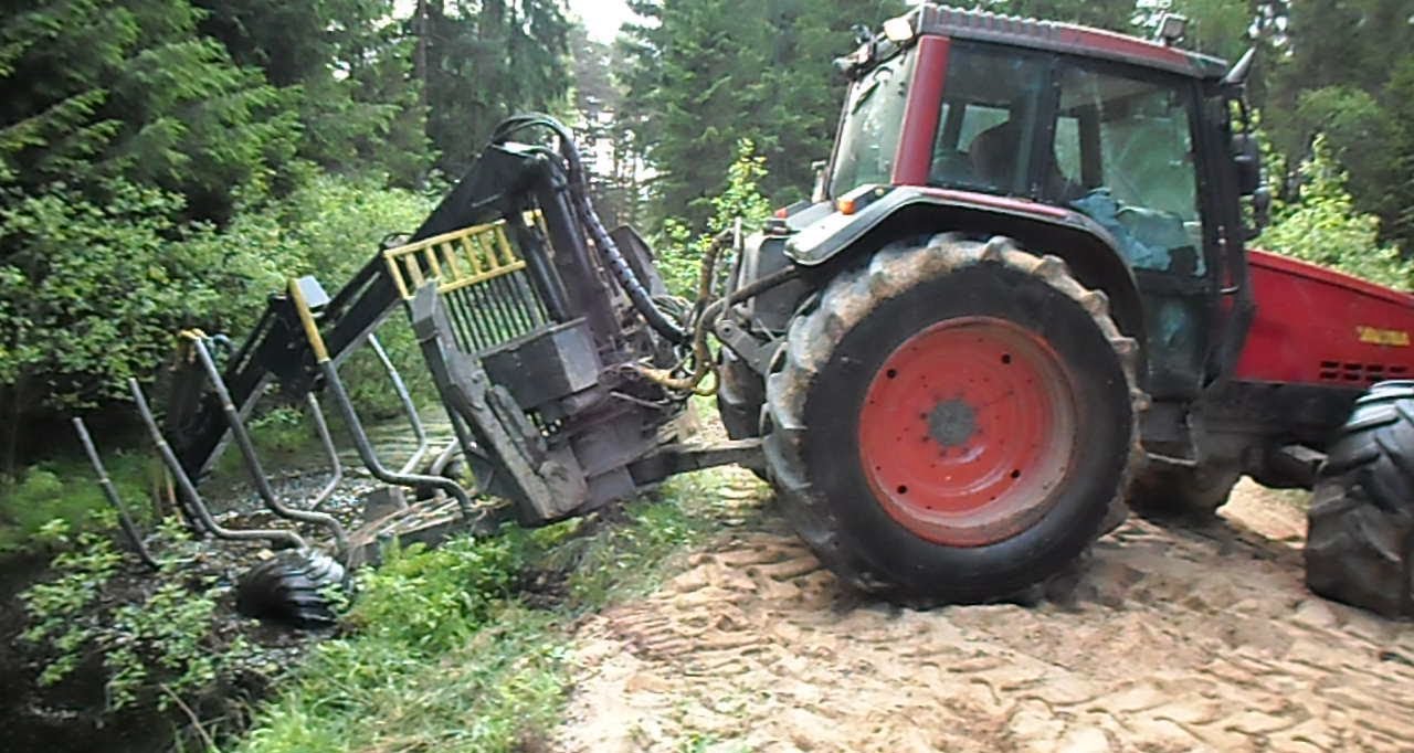 Valtra forestry tractor turns around on the narrow road