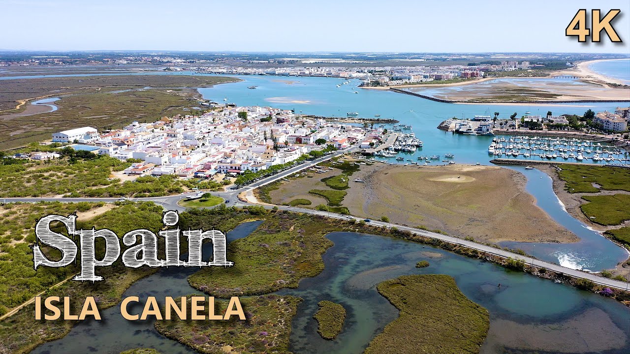 Aerial view of Isla del Moral and Puerto Deportivo Isla Canela, Huelva. UHD 4K.