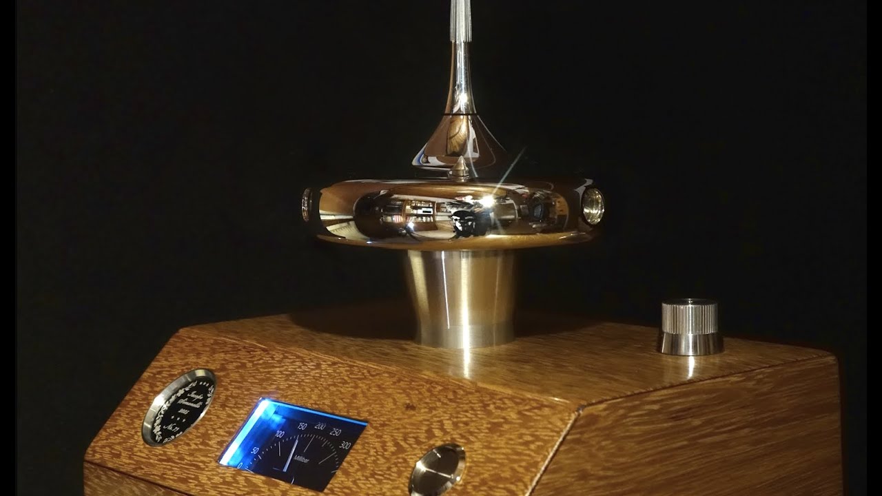 Spinning top floating on an air cushion