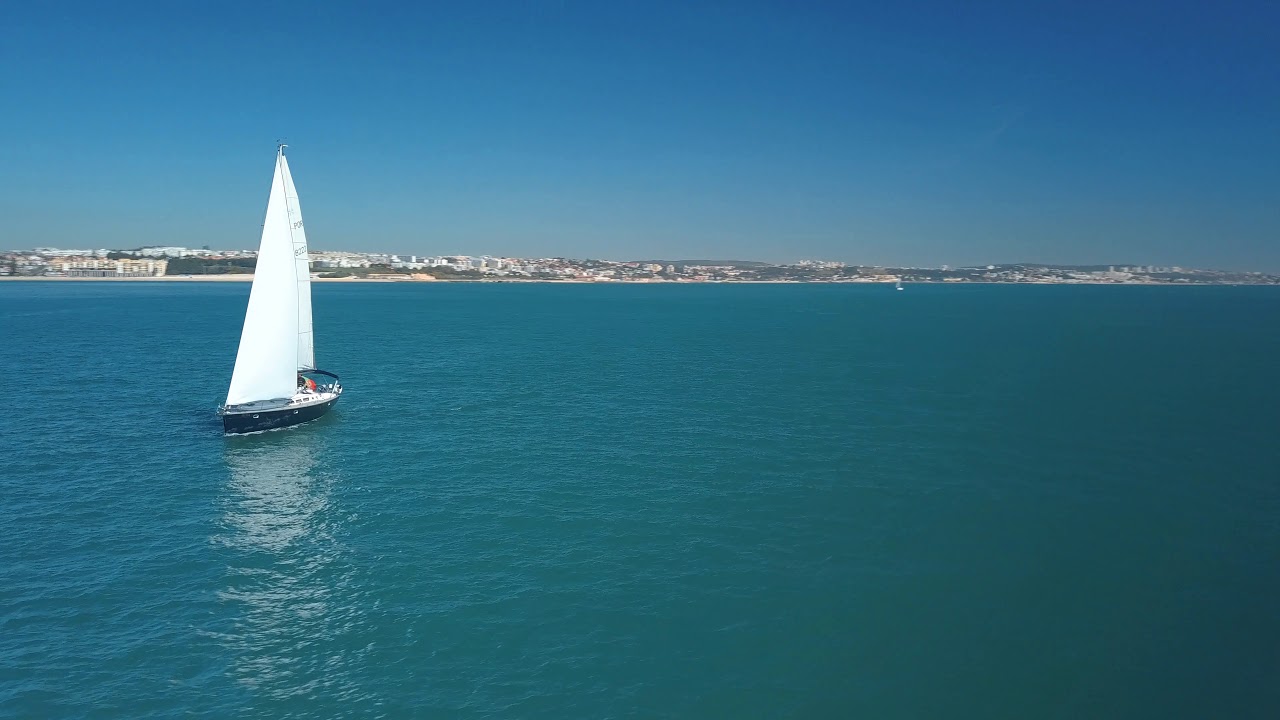 Aerial View 4K - Sailboat in Tejo river - Lisbon - Portugal