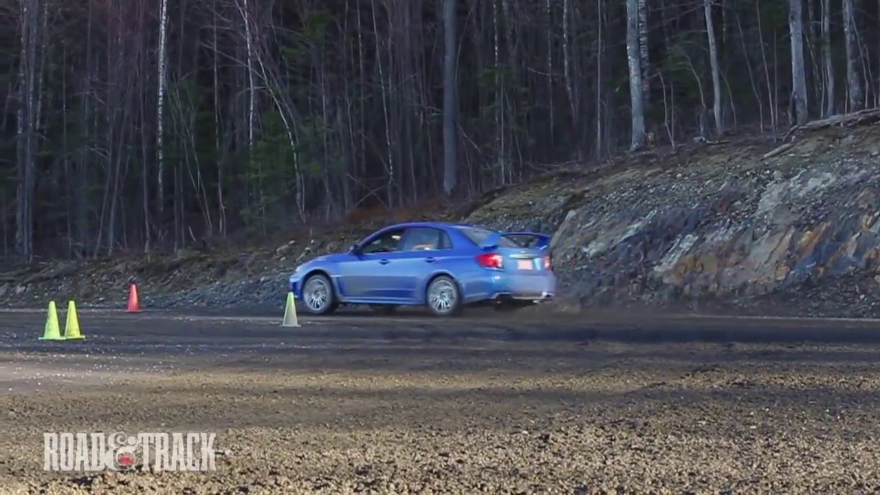 STI vs. Evo Rally Road Test | Road and Track