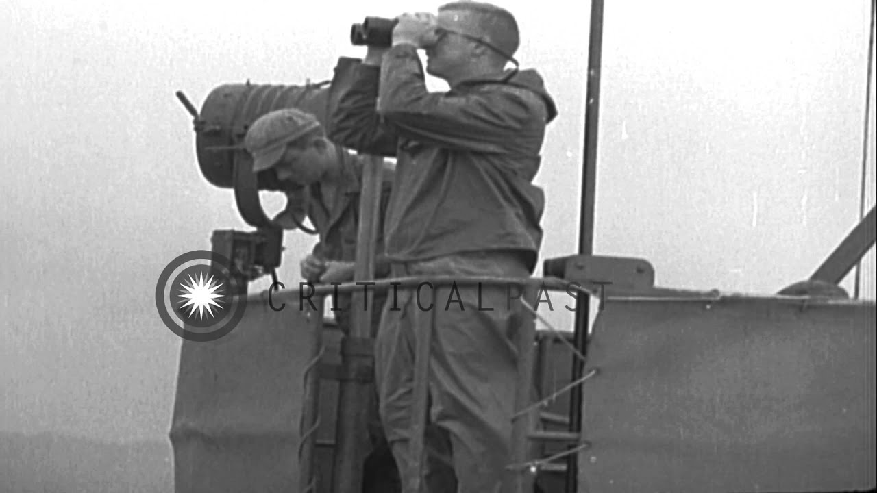 Soldiers seated in a landing barge and a rainbow in the background in Okinawa, Ja...HD Stock Footage