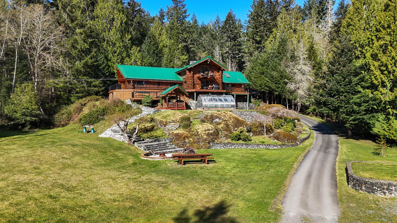 Inside a Hand-Crafted West Coast Log Estate Backing Onto 3,400 Acres of Wilderness | Sooke BC