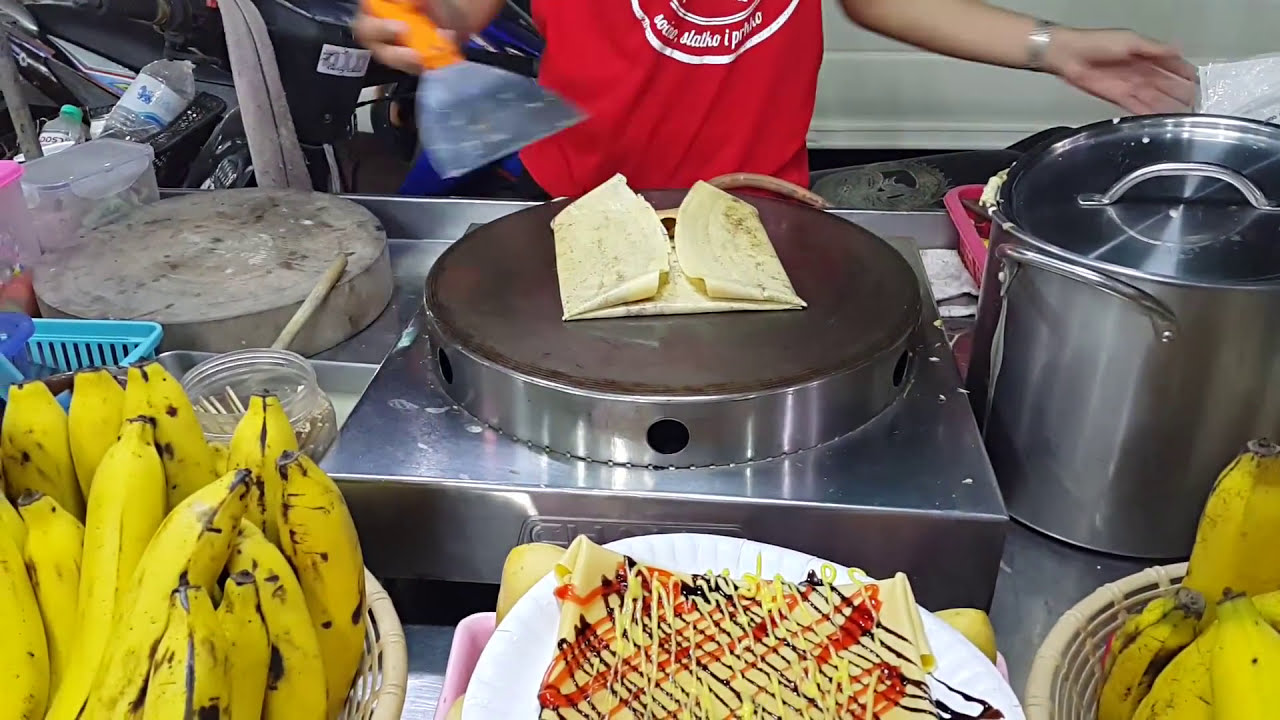 Banana Nutella Pancake made by a street vendor in Phuket, Thailand [HD]