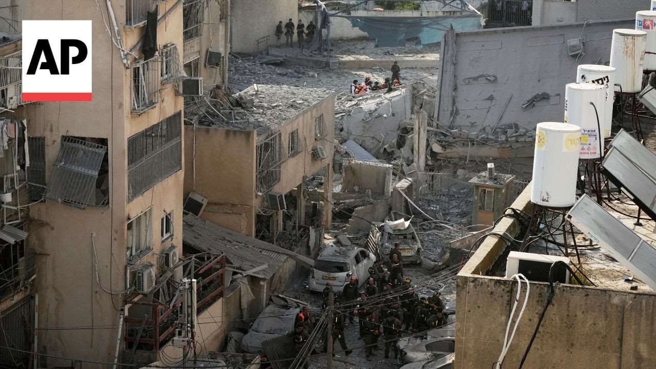 Buildings and vehicles damaged after Iran strike in Bnei Brak, Israel