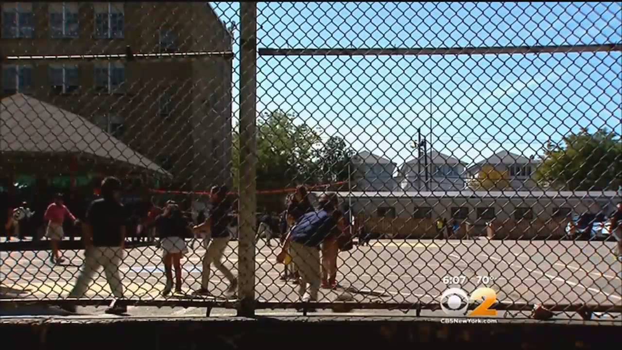 Students At Newark Elementary School Share Playground With Teachers' Cars