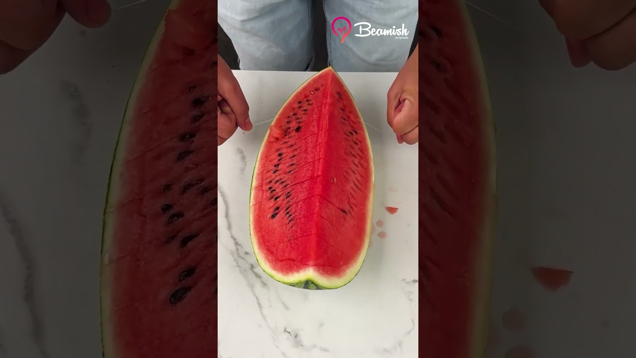Watermelon cut using dental floss 🍉#easy #watermelon #cut #floss #trick
