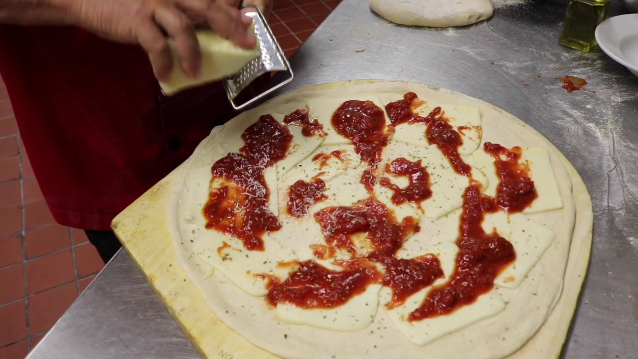 Metro Pizza's John Arena makes pizza with dough, sauce and soul