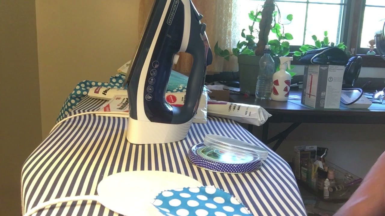 Adding a circle of fabric to bottom of rope / fabric bowl using iron on adhesive.