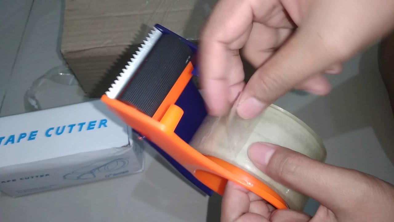 Cara memasang dispenser lakban