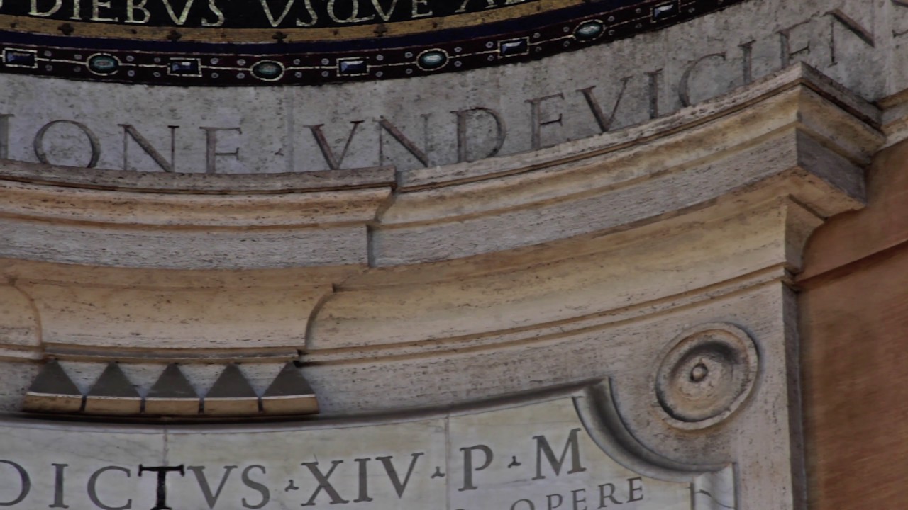 Slow pan of Latin engraved in Triclinium